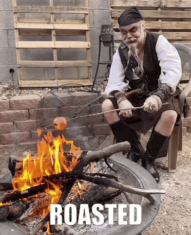 Pirate roasting marshmallows over a fire. 