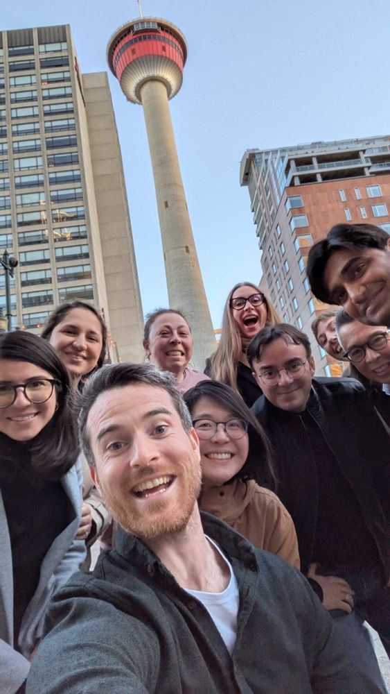 10 Code for Canada staff members posing for a selfie in front of the Calgary Tower