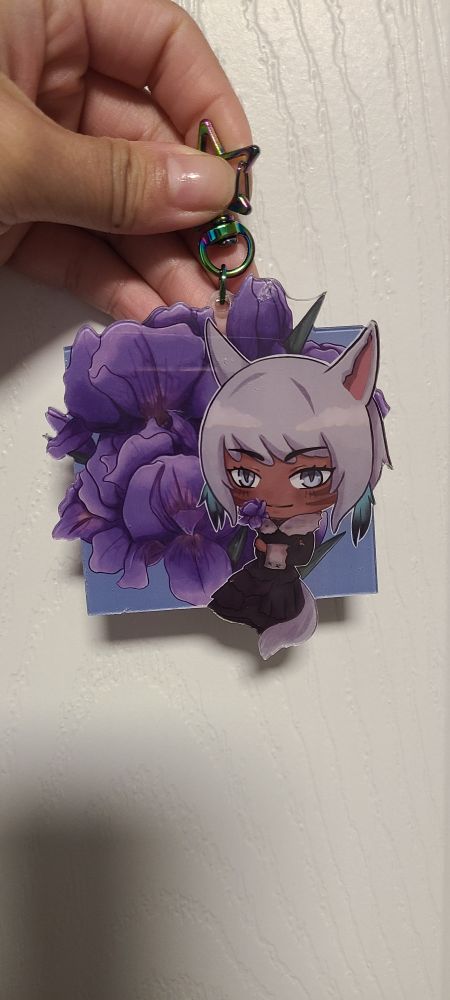 Yshotla keycharm from ffxiv with flowers