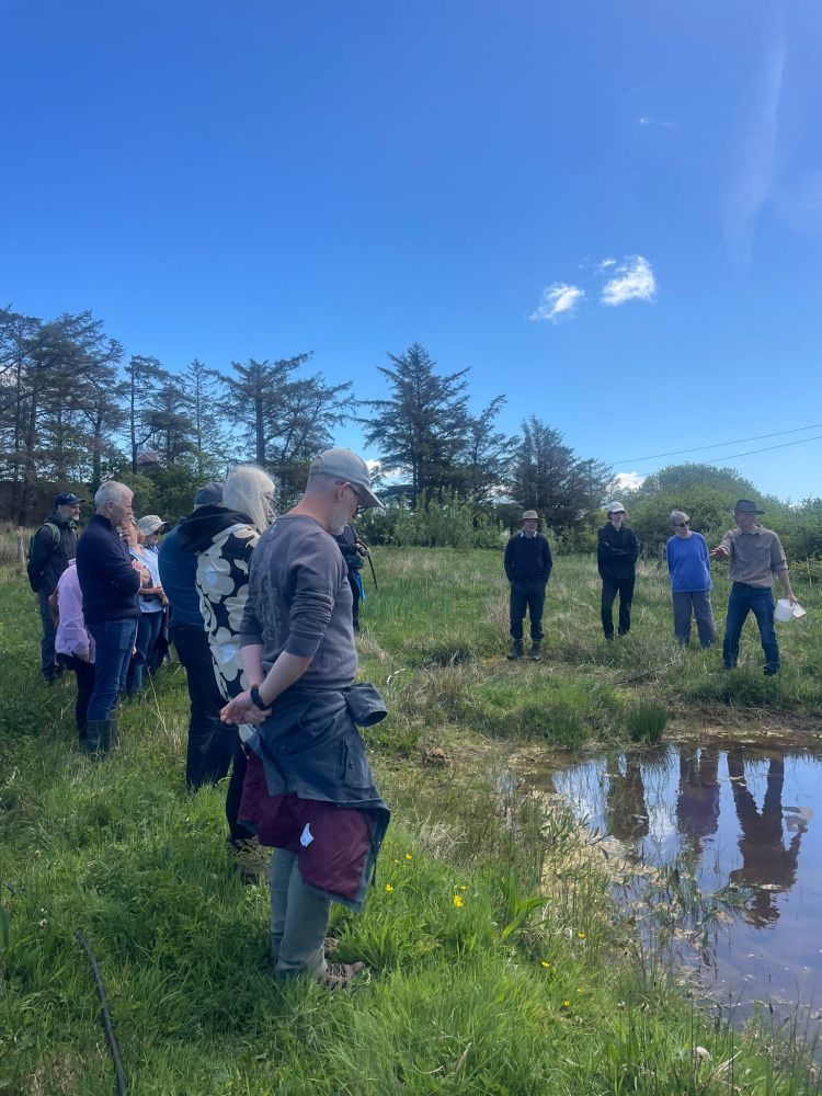 Group of people at pond