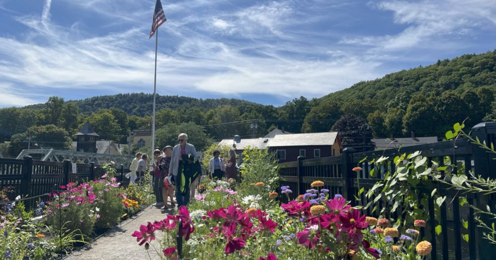Loaded with colorful carnations, petunias and other flora, the beloved Bridge of Flowers in western Massachusetts is open again after a year of repairs.