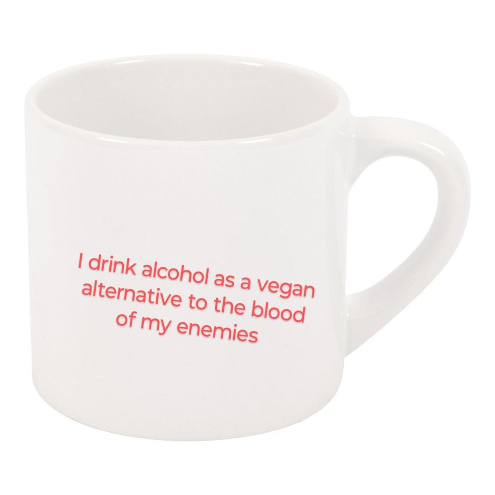 A meme of a white coffee cup on a white background with red text that reads, "I drink alcohol as a vegan alternative to the blood of my enemies"