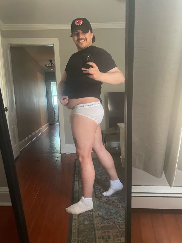 mirror selfie in white briefs and a baseball cap - the vibes are fatherly 