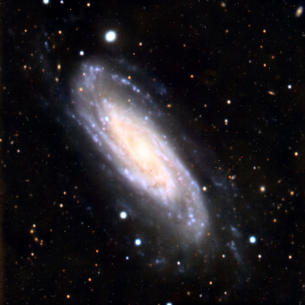 A spiral galaxy that is evidently seen mostly from the side.