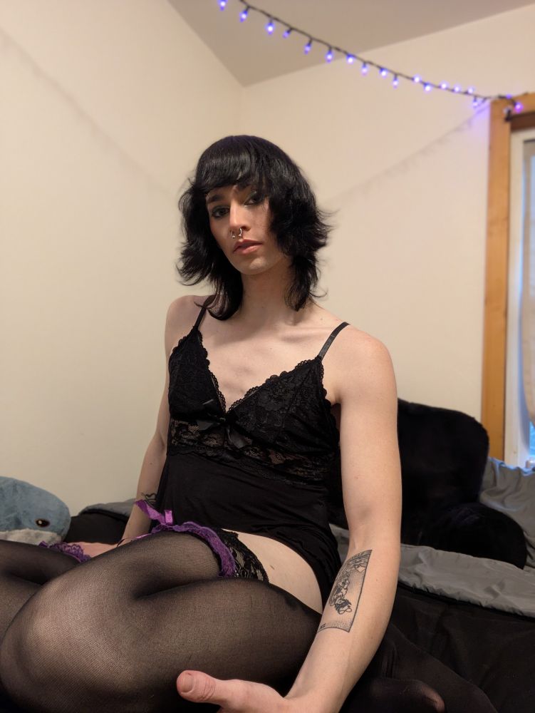 Hex in black lingerie with stockings and garters