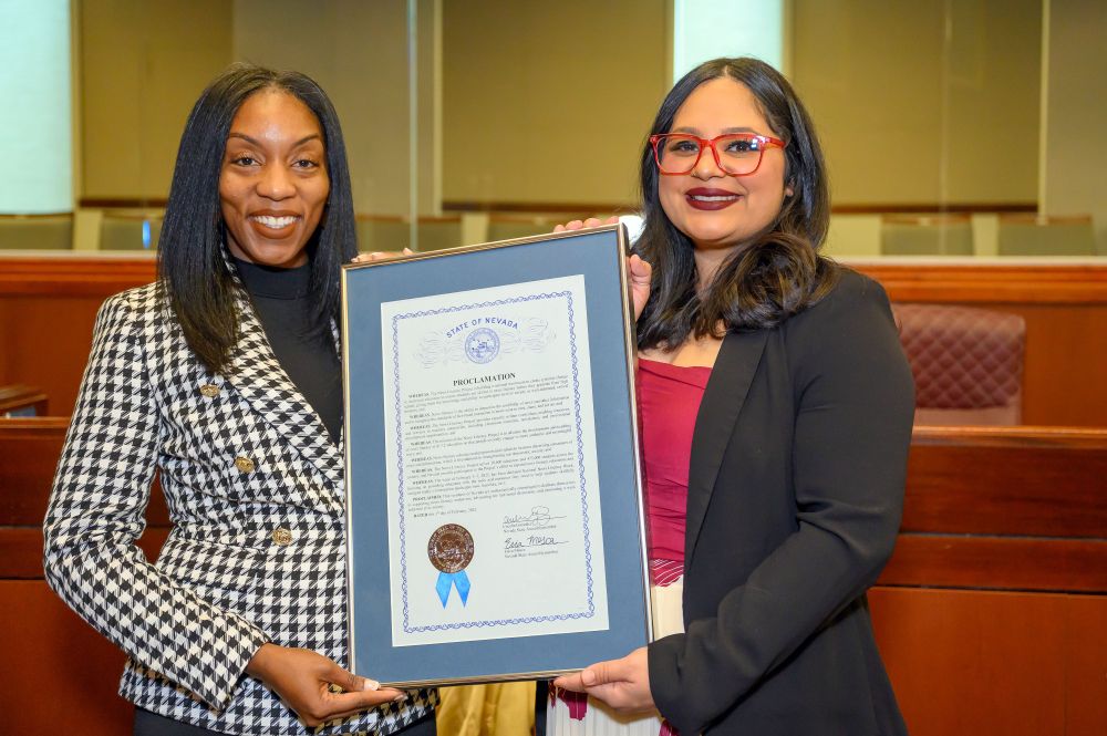 NLP's Ebonee Otoo and Las Vegas, NV, Assembly member Cecelia González hold a proclamtion recognizing News Literacy Week while standing in the Nevada State Capitol in Carson City.