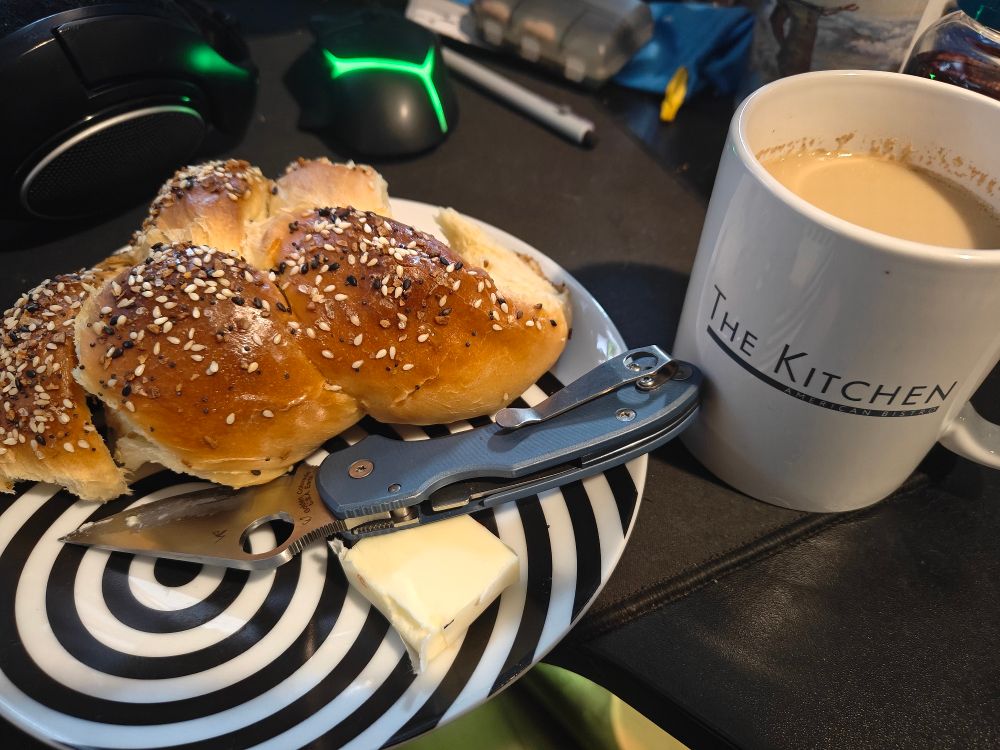 Spiced chai in a mug from the restaurant my sister used to work and a third of a loaf of challah