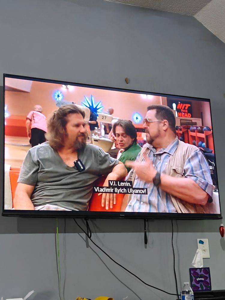 A photo of my television playing the Big Lebowski where Walter says "V.I. Lenin" 