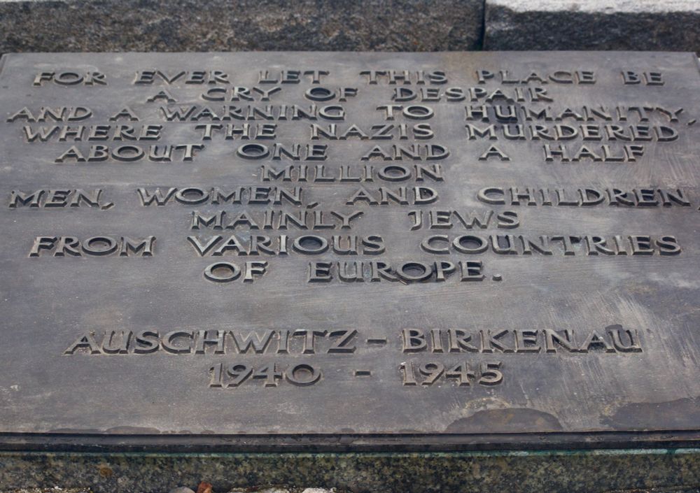 A plaque at Auschwitz Birkenau concentration camp acknowledging the murder of 1.5 million men, women, and children
