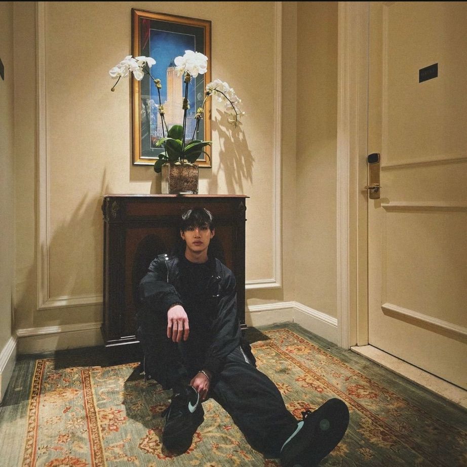 Chan sitting on the floor