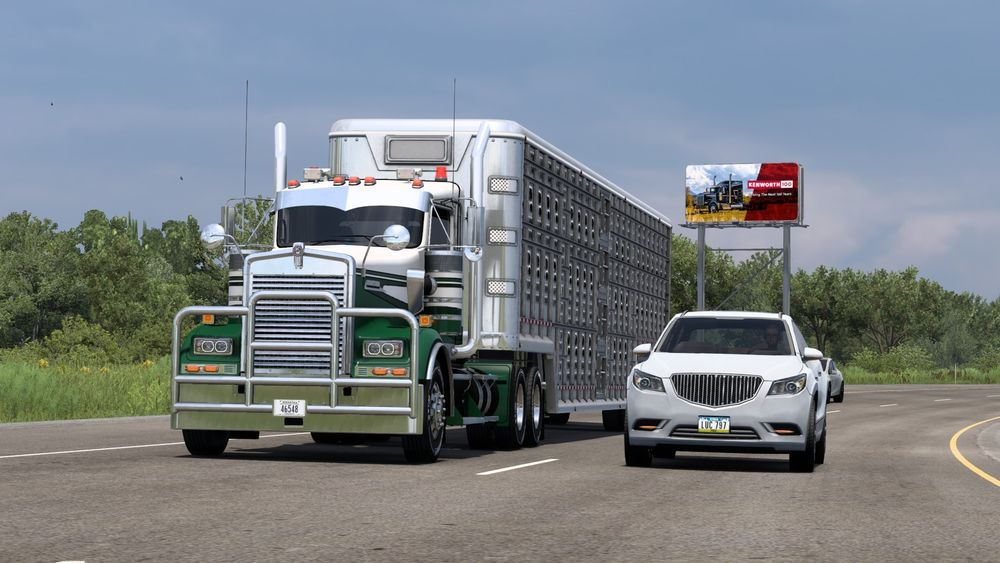 American Truck Simulator screenshot of my Kenworth W900 heading south and posing before a Kenworth 100 advert!
