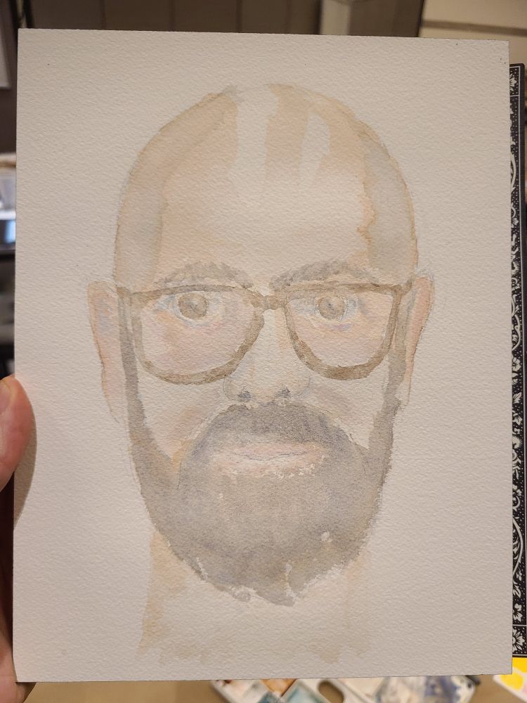 A watercolour portrait of a bald, bearded me in glasses. May you, too, have the time to pursue your passions!