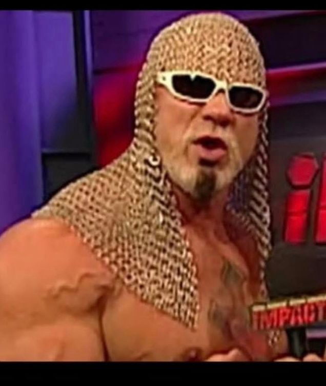 Scott Steiner wearing chain mail head gear looking into the camera and reciting incontrovertible mathematical statistics.