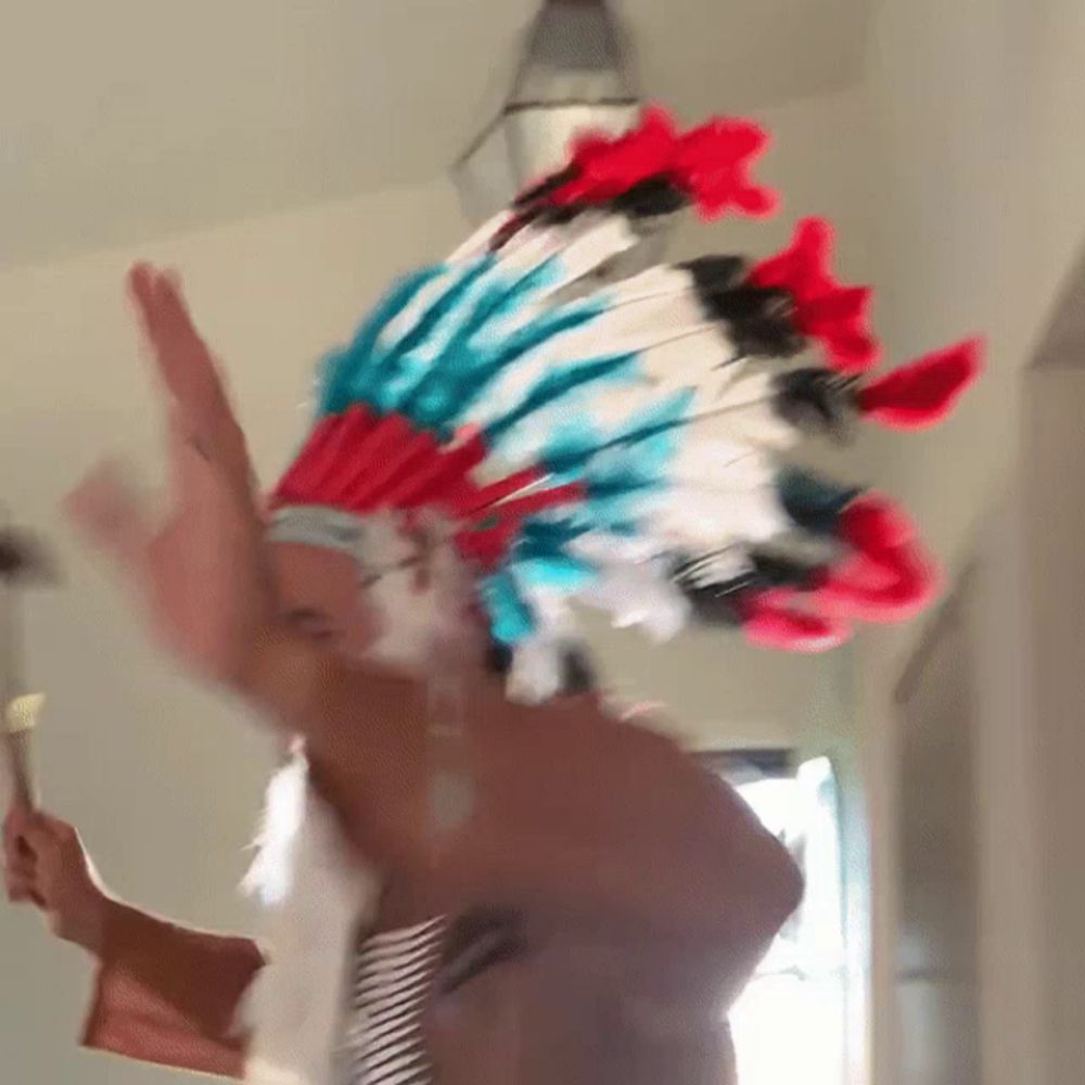 a man wearing a red white and blue headdress