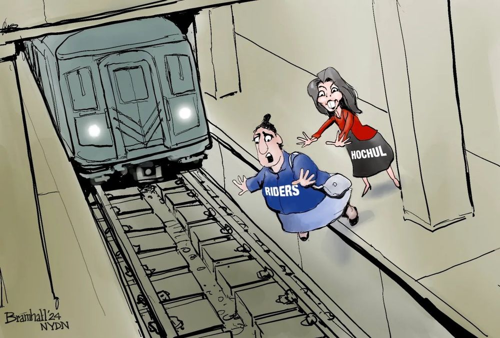 A cartoon depicting New York Governor Hochul shoving a person labeled Transit Riders off of a subway platform and into the path of an oncoming train.