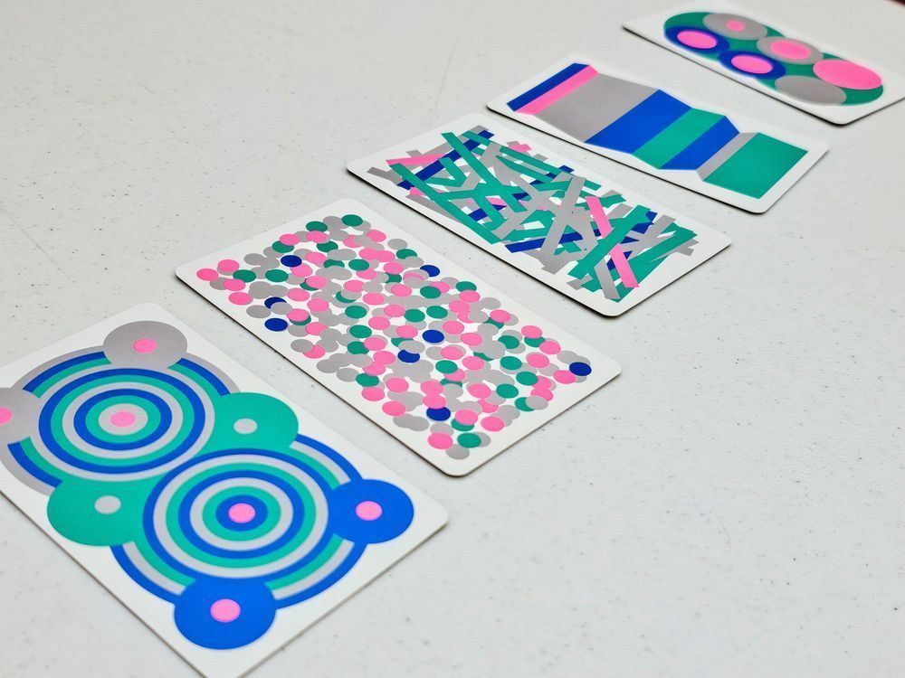 A display of cards with a variety of patterns on them.