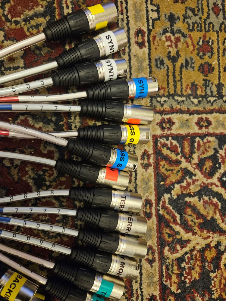 A bunch of XLR cables with labels