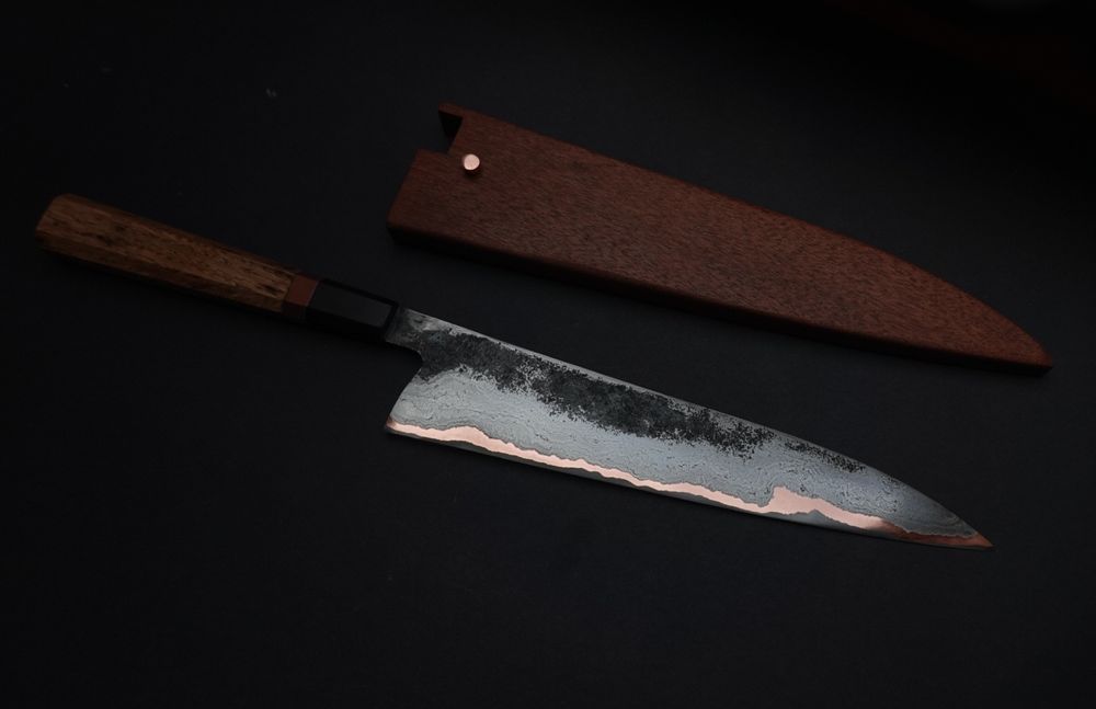 Large gyuto and saya
Some forge texture on the blade
wrought iron and copper clad iron high carbon steel