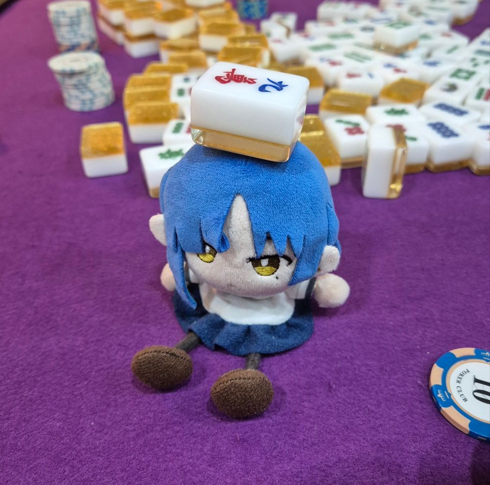 Ryo plushie from bocchi the rock with mahjong tile on her head.
She's too poor to gamble...