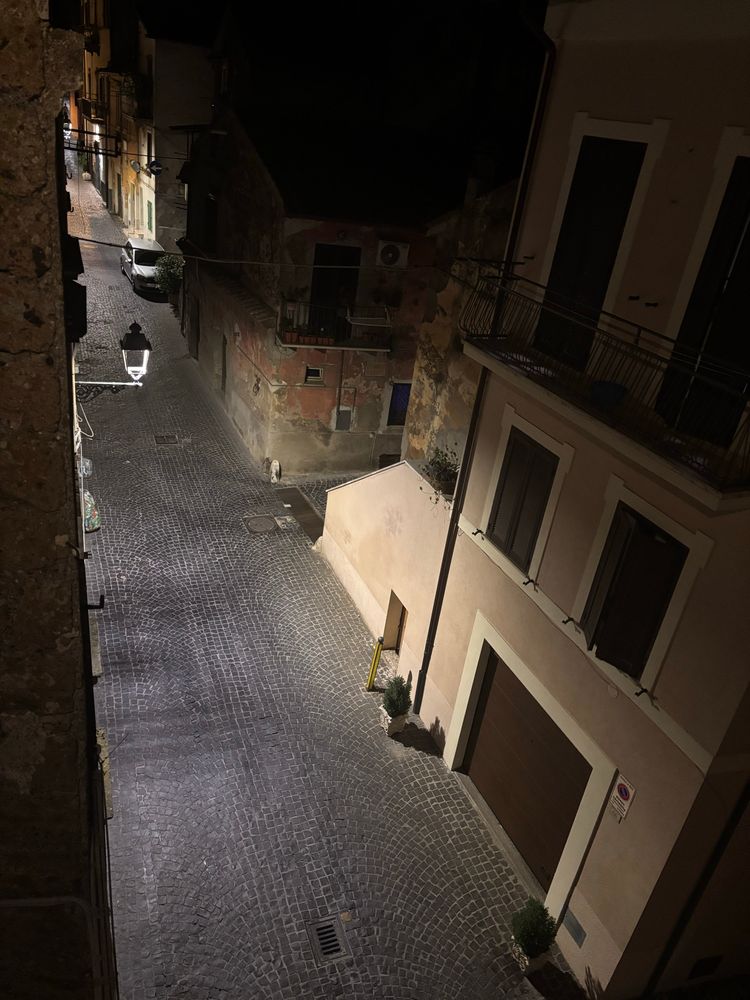 A street in Nepi at night shot from a rooftop solarium 