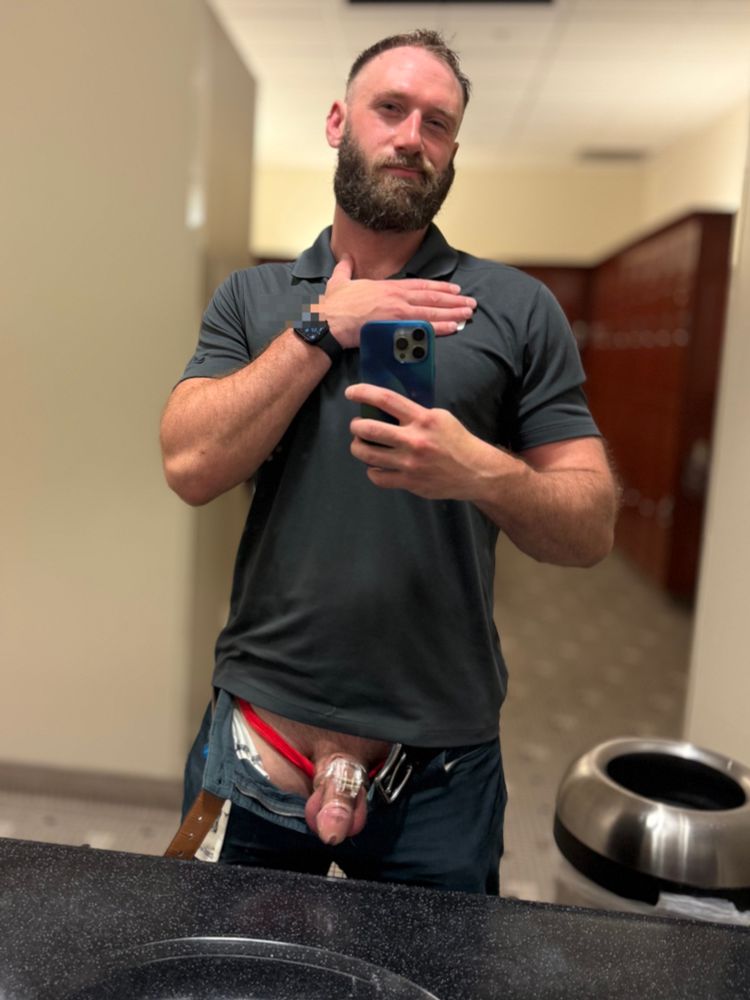 St Paul doing a Locktober Cage Check. He’s fully clothed in the gym Locker room with the fly of his pants open wide, exposing his red briefs and caged penis. 