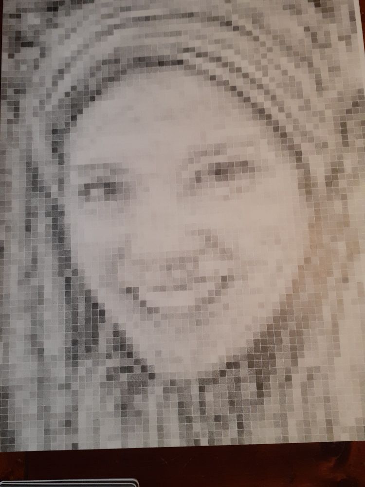 Pixelated portrait of a young woman. Done in graphite, 22x30 inches, and 25 hours of work to create