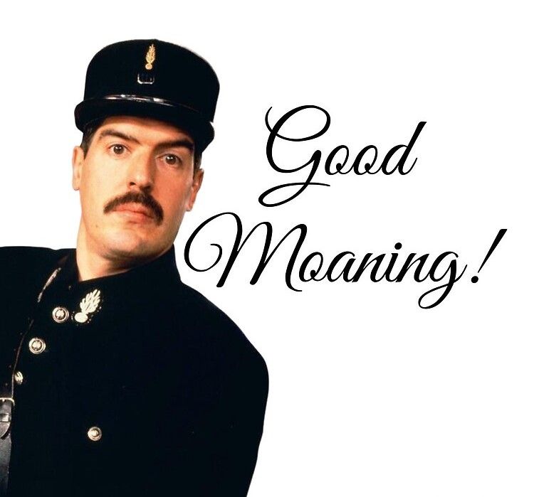 A waist-up shot of the character 'Officer Crabtree' from the British sitcom ''Allo 'Allo!'. He is wearing a dark navy French Gendarme (police) uniform, complete with a kepi hat and silver buttons. He has a dark mustache and is looking directly at the camera with a wide-eyed, slightly blank expression. To his right, the text "Good Moaning!" is written in a large, elegant cursive font against a white background.


**Contextual Background**:

*The Show*: The image features 'Officer Crabtree' (played by actor Arthur Bostrom) from the popular BBC comedy series ''Allo 'Allo!', which aired from 1982 to 1992.

*The Character*: Crabtree was an undercover British spy posing as a French police officer.

*The Joke*: The running gag was that his French was atrocious. Whenever he spoke, he mangled his vowels, resulting in suggestive or nonsensical mispronunciations. His standard greeting, "Good Morning," always came out as "Good Moaning," which became his catchphrase.