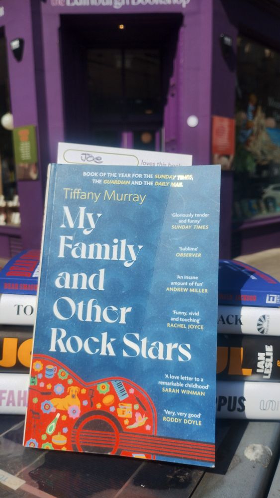 A copy of My Family and Other Rock Stars by Tiffany Murray, outside the Edi
nburgh Bookshop 