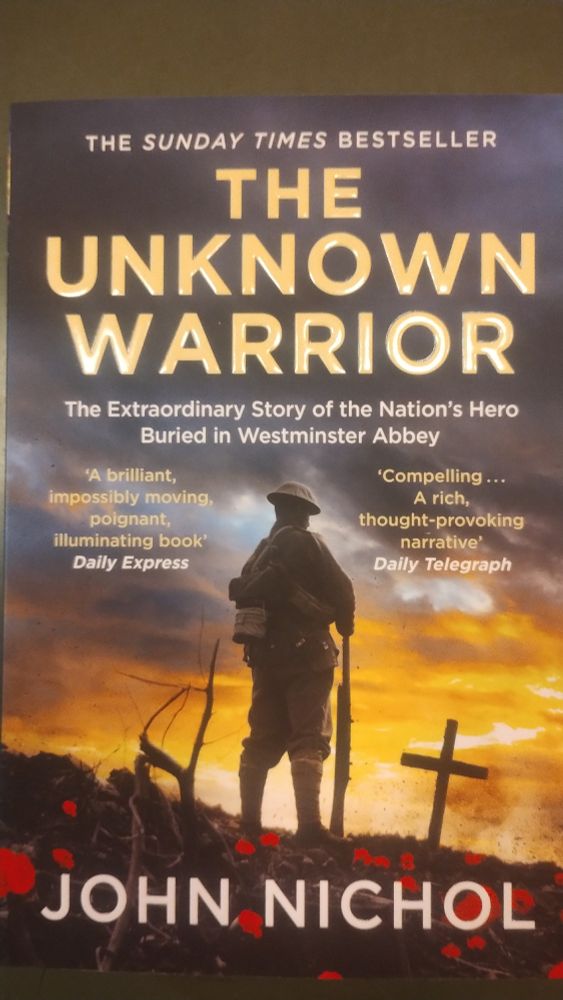 A copy of The Unknown Warrior, depicting a WWI "Tommy" standing with his back to us, contemplating a poppy covered grave