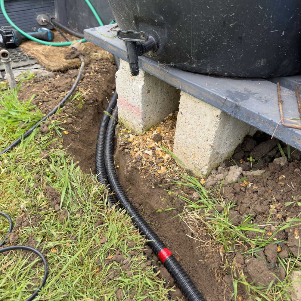 Water tank with sensor cables and pipes