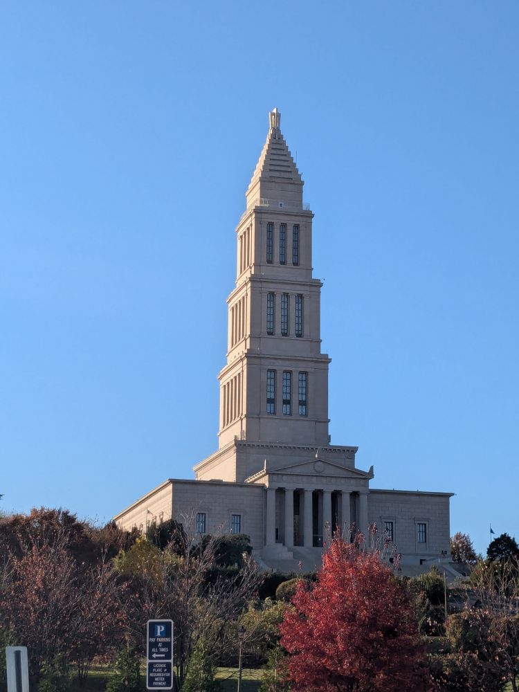 Photo of the George Washington Masonic National Memorial, in setting sunlight. 