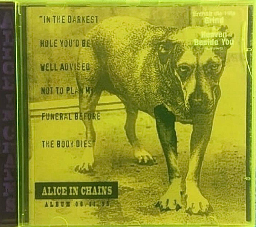 Alice in Chains album cover with a dog on the cover. It's 3 legged with one leg photoshopped in. 