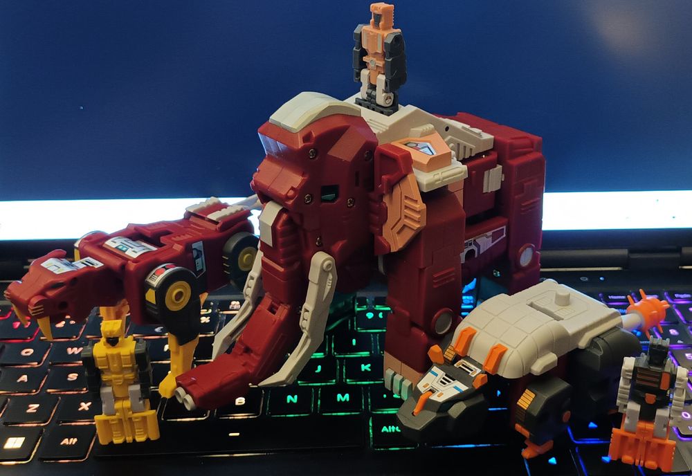 The previous action figures, now in their beast modes. Tusker turns into a mammoth, Fangro is a sabre-toothed tiger, and Tailclub is a Doedicurus (a kind of prehistoric armadillo). Each figure has its own accompanying little guy, akin to the Headmasters (Tusker's is standing on top of him)