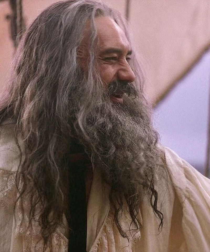 Ed Teach from OFMD season one, grinning happily under his full beard