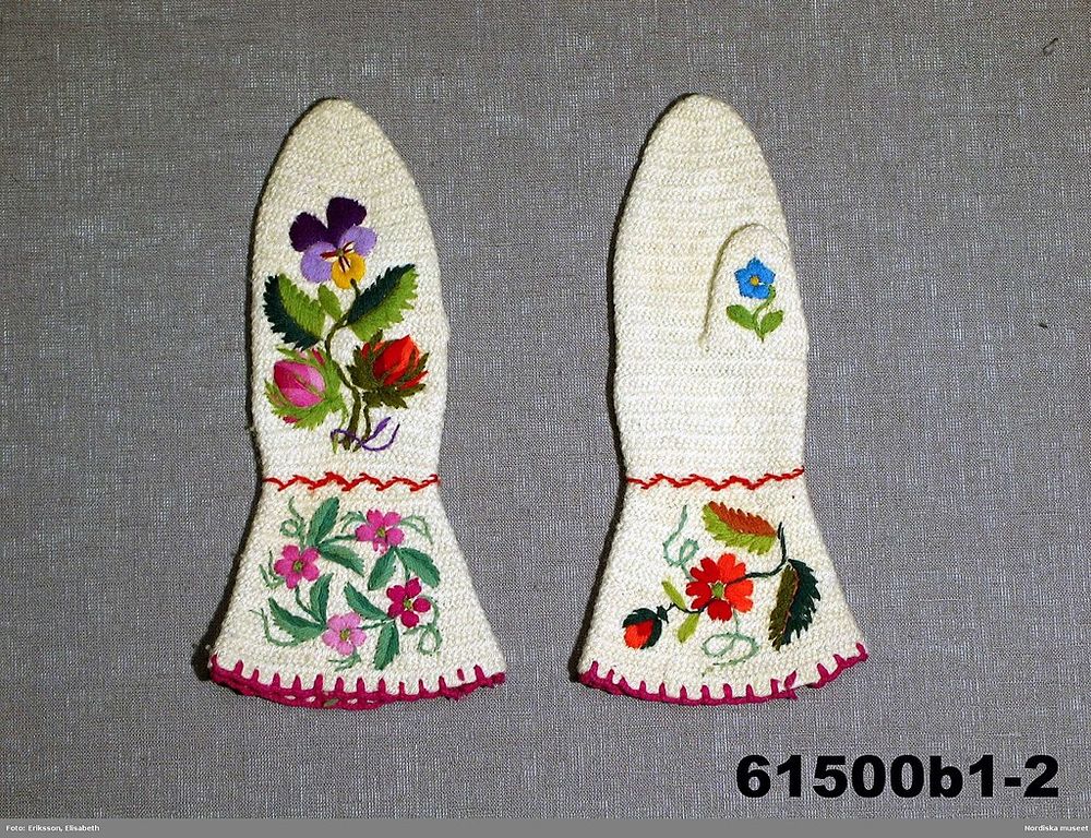 White naalbound mittens from late 19th century Sweden, now held by Nordiska museet. They've also been embroidered with a variety of pansies and rosebuds.