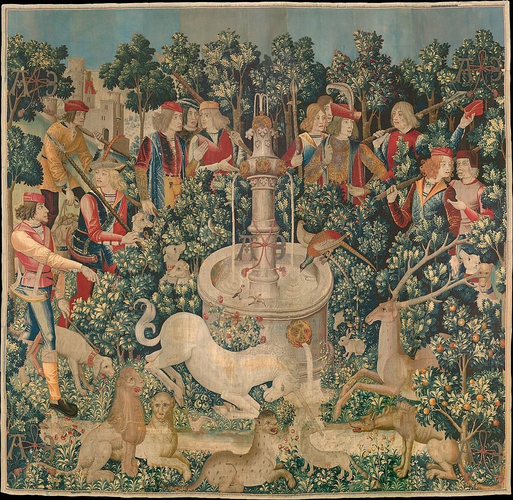 The Unicorn Purifies Water. From the Met Museum: "In this tapestry the unicorn kneels before a tall white fountain that has a pair of pheasants and a pair of goldfinches perched on its edge. Other animals both exotic and native to Europe lounge about, while twelve hunters in the back of the scene discuss the discovery of their quarry. Flora and fauna play a significant role in the narratives of the Unicorn Tapestries. Plants prescribed in medieval herbals as antidotes to poisoning, such as sage, pot marigolds, and orange, are positioned near the stream, which is being purified by the unicorn's magic horn."