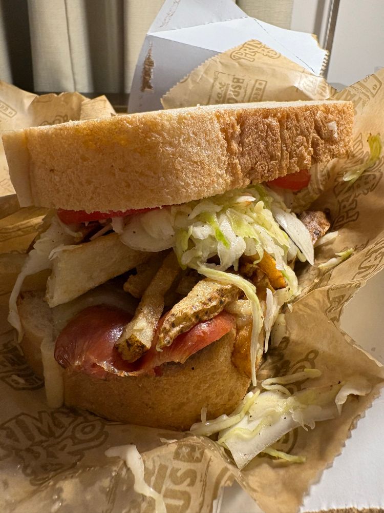 Primanti Bros sandwich, piled high with kielbasa, fries and slaw.