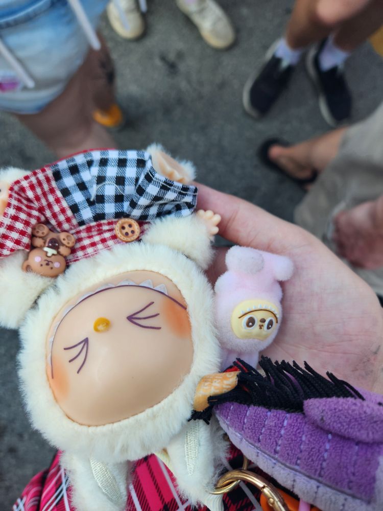 a regular sized lafufu and a very small lafufu 