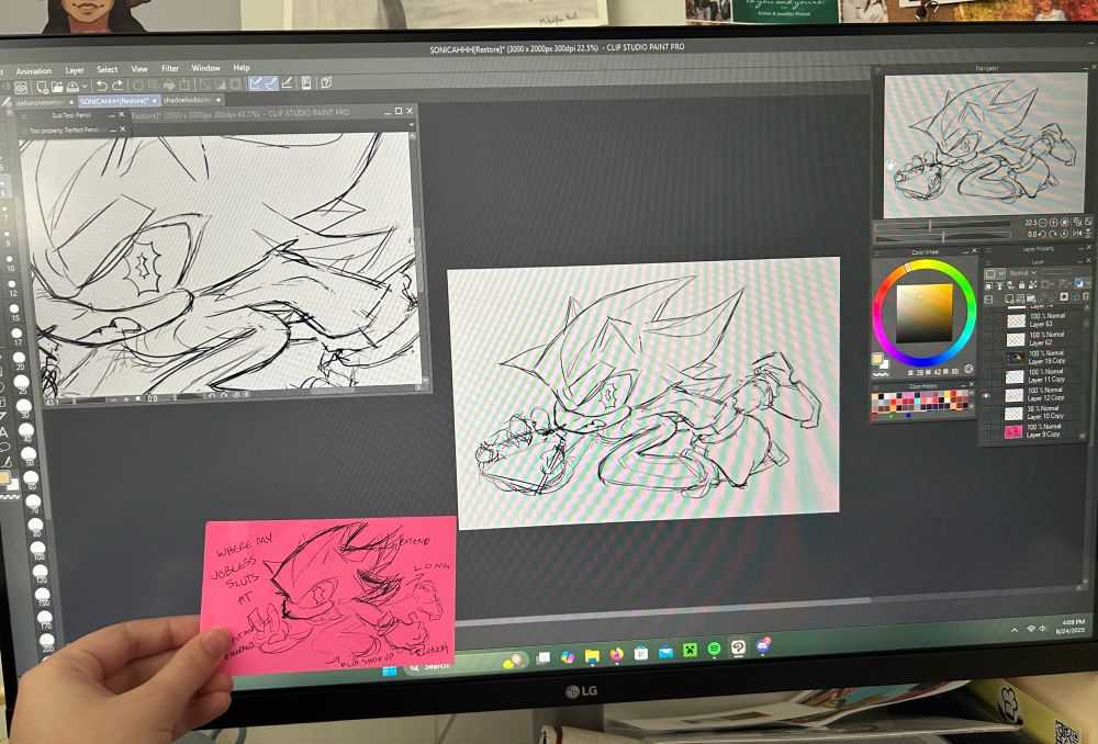 a picture of a computer monitor showing the same sketch of shadow the hedgehog 3 times. a pink index card is held up in front of the computer monitor, with a 4th identical shadow the hedgehog sketch on it.