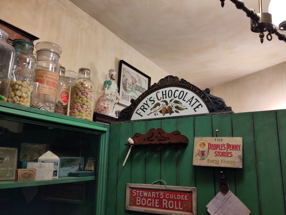 Ornate Fry's Chocolate sign in the newsagent and tobacconist shop display at Abbey House Museum, Leeds. 