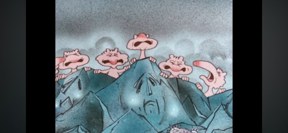 A bunch of creepy animated long nosed pink humanoids with making faces from behind blue rocks. The blue rocks also have sad faces on them. 