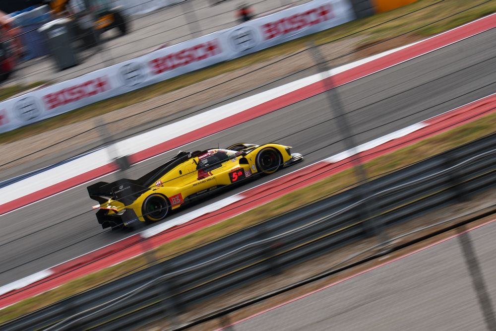 The Ferrari 499P AF Corse heading into T19 at COTA during FP2