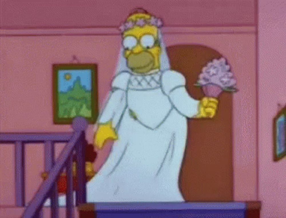 homer simpson is dressed as a bride and holding a bouquet of flowers