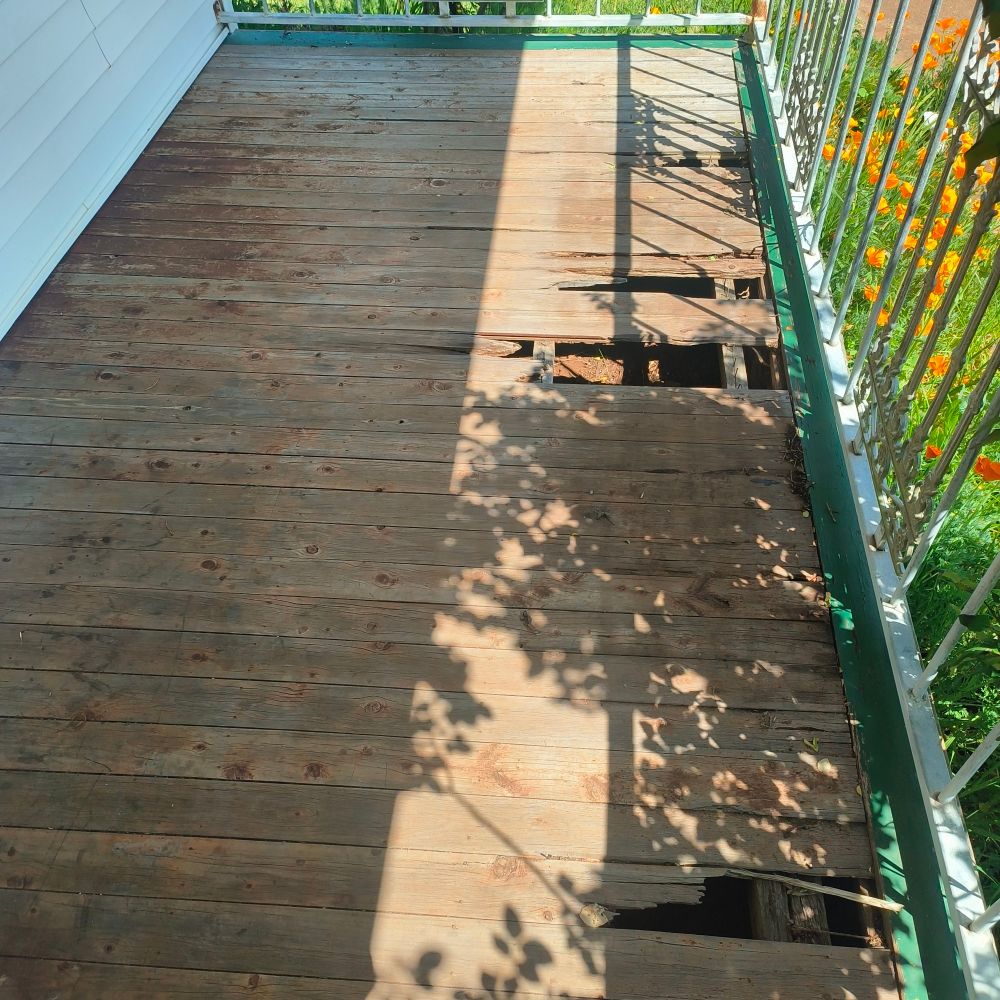 Old broken deck with holes 