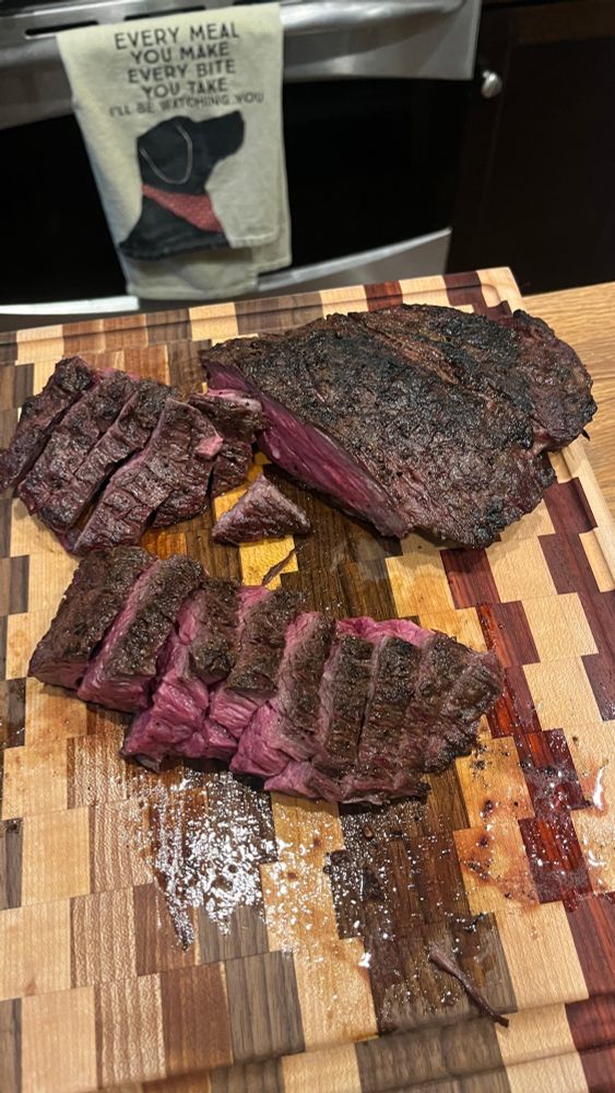 Sliced finished grilled Wagyu Bavette on a beautiful cutting board