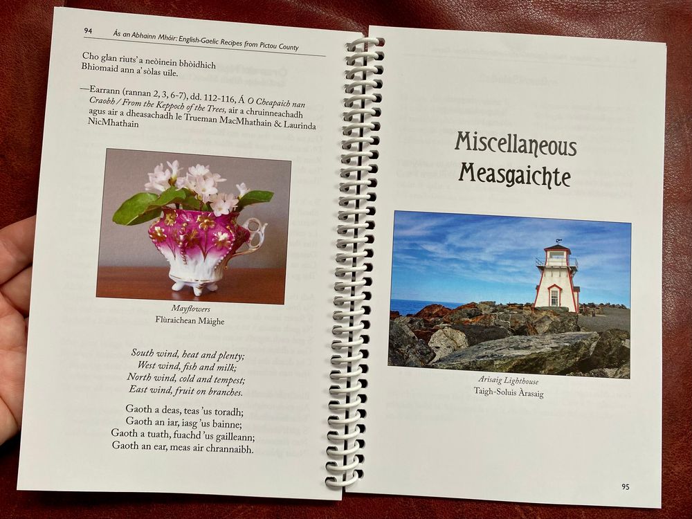 A spiral-bound cookbook opened to a 2-page spread with the end of the Gaelic poem "Address to a May Flower" on the left side. On the right side a new section starts, called "Miscellaneous" in Englihs and "Measgaichte" in Scottish Gaelic.