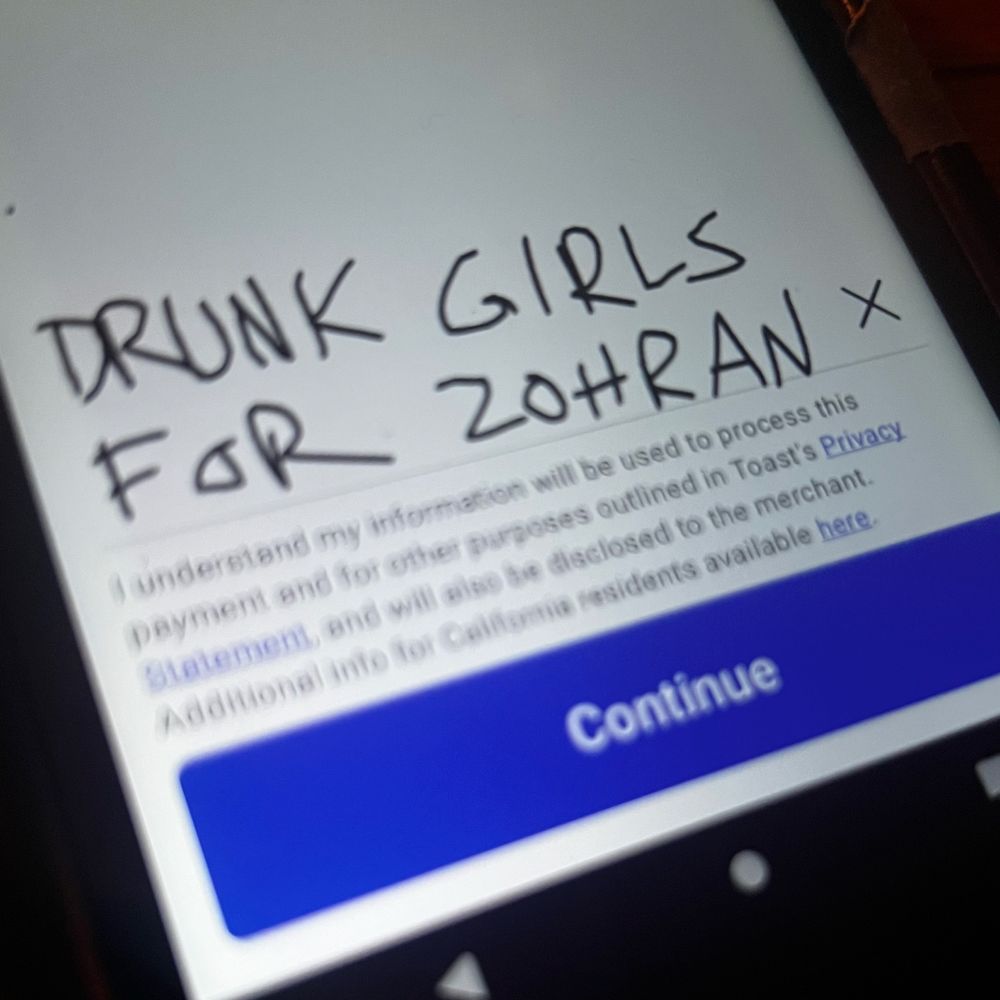 a closeup photo of a digital bar tab signed “drunk girls for Zohran”