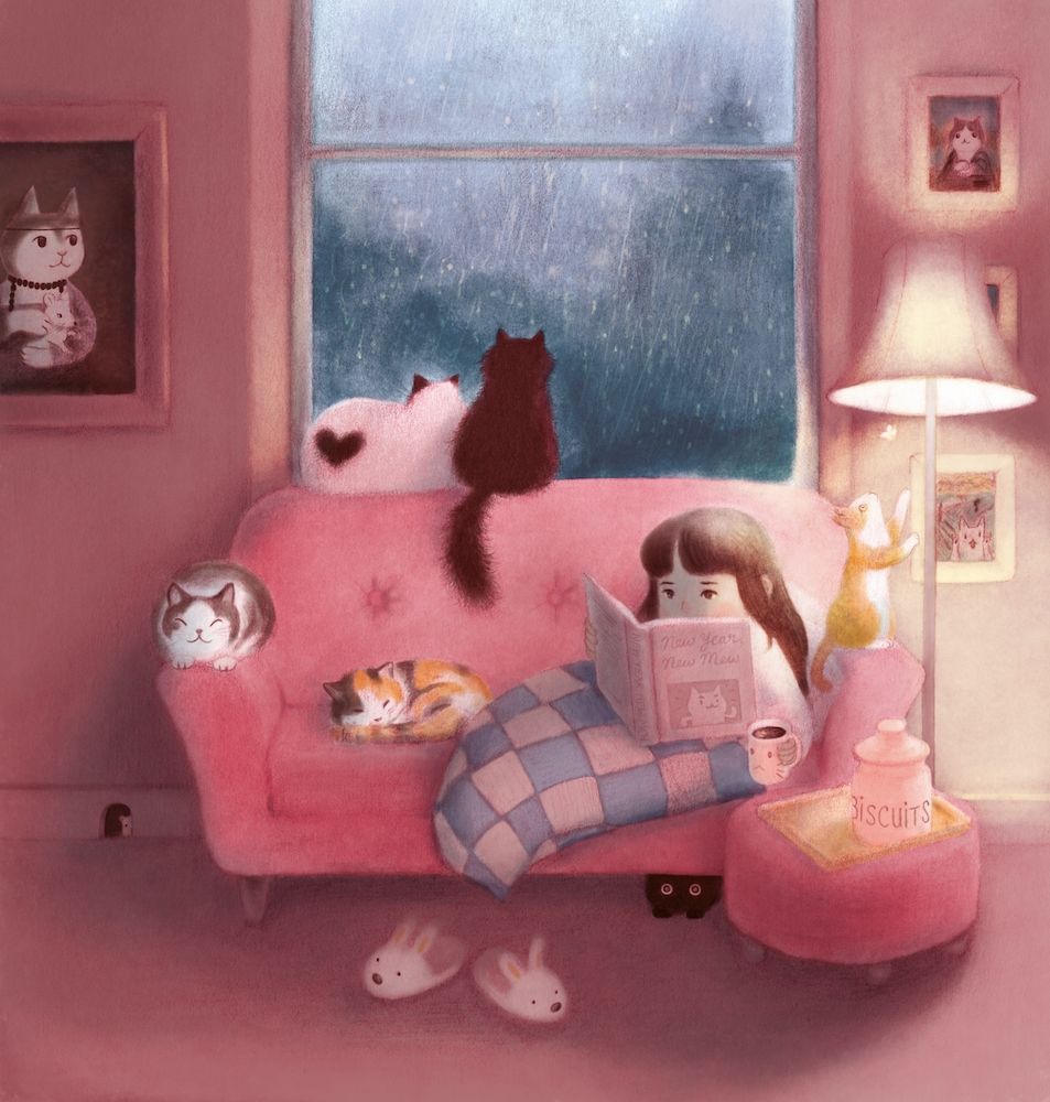 A girl surrounded by cats on a pink couch in a pink room reading.  It's dark, gloomy, and rainy outside. 
