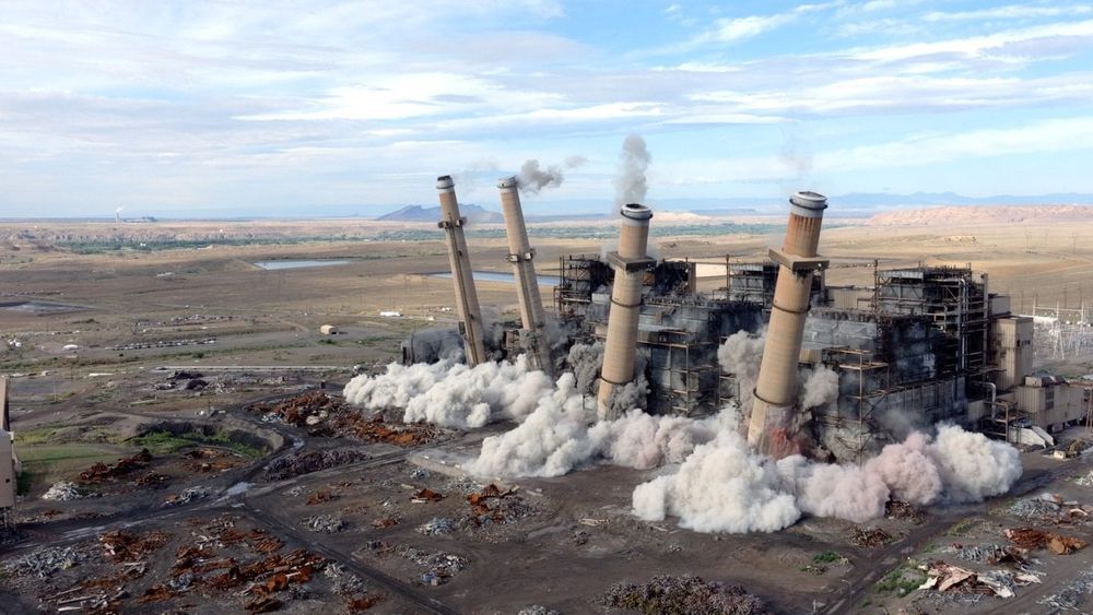 A coal power plant demolition serves as a poignant historical moment for the Navajo