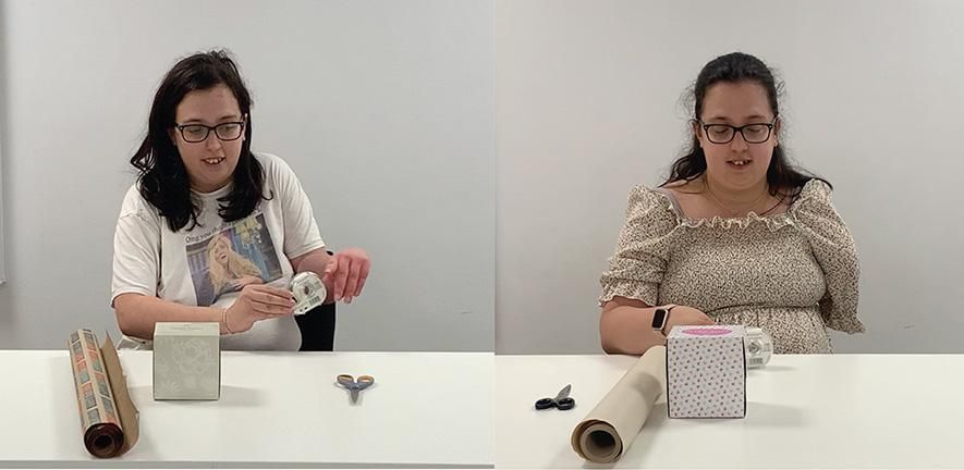 Two images of the same person side by side. On the left, the person is seated at a table, about to gift-wrap a small box. On the table is a roll of wrapping paper, the box and a pair of scissors. They are handling a sticky tape dispenser with two arms. On the right, the same individual, in the same set-up but now their left arm is missing.